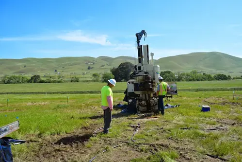 Cascade employees working with a direct push drill