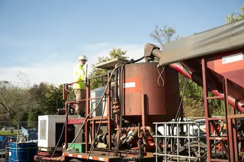 Cascade Environmental employee monitoring a dangerous chemical