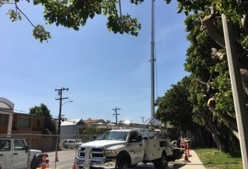 A photo of a drill rig on the side of a closed street