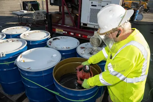 Cascade employee handling chemicals